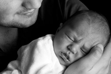 holding a newborn